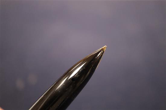 A group of five vintage fountain pens, including a Watermans orange and black marble effect pen